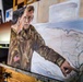 Artist-In-Residence Paints Picture of Soldiers' Lives.
