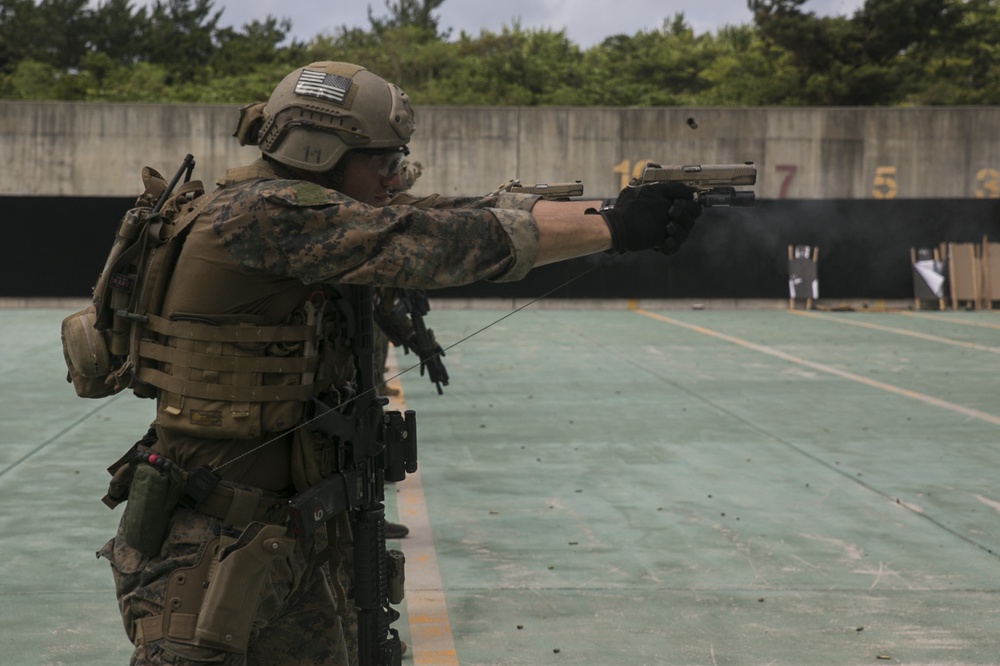 Force reconnaissance Marines conduct pistol and rifle qualification