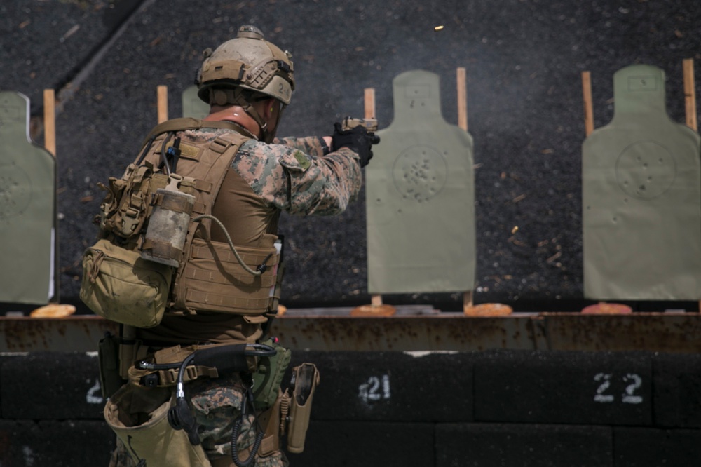 Force reconnaissance Marines conduct pistol and rifle qualification