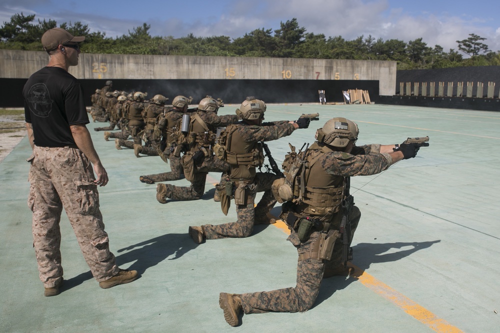 Force reconnaissance Marines conduct pistol and rifle qualification