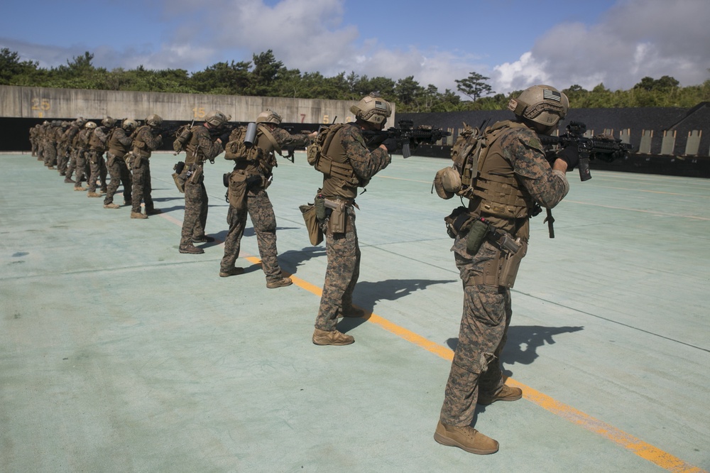 Force reconnaissance Marines conduct pistol and rifle qualification