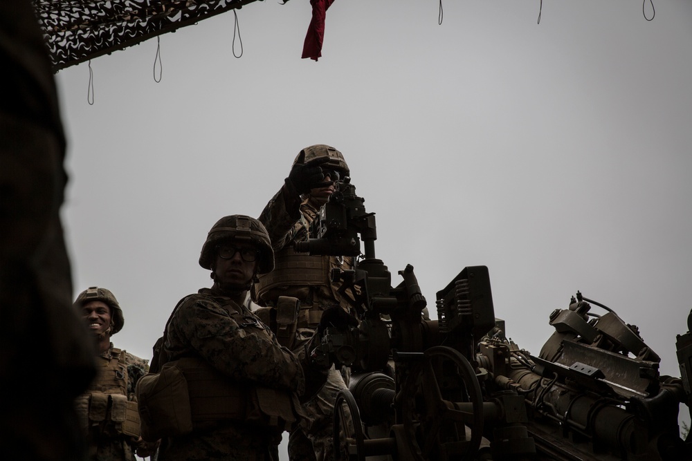 U.S. Marines deliver the boom during RIMPAC