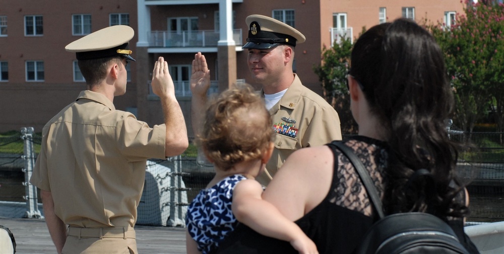 Family members watch with pride during re-enlistment aboard the USS Wisconsin