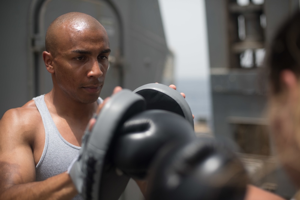 Sparring for exercise on USS Jason Dunham (DDG 109)