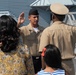 Family members watch a re-enlistment aboard the USS Wisconsin