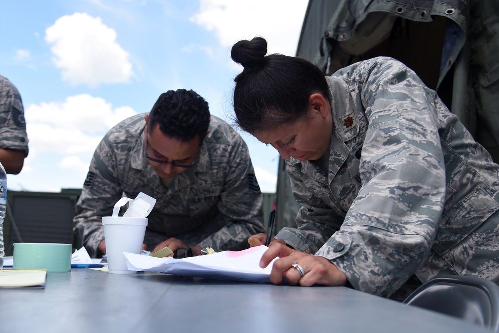 Airmen treat patients with Disaster Medical Assistance Team