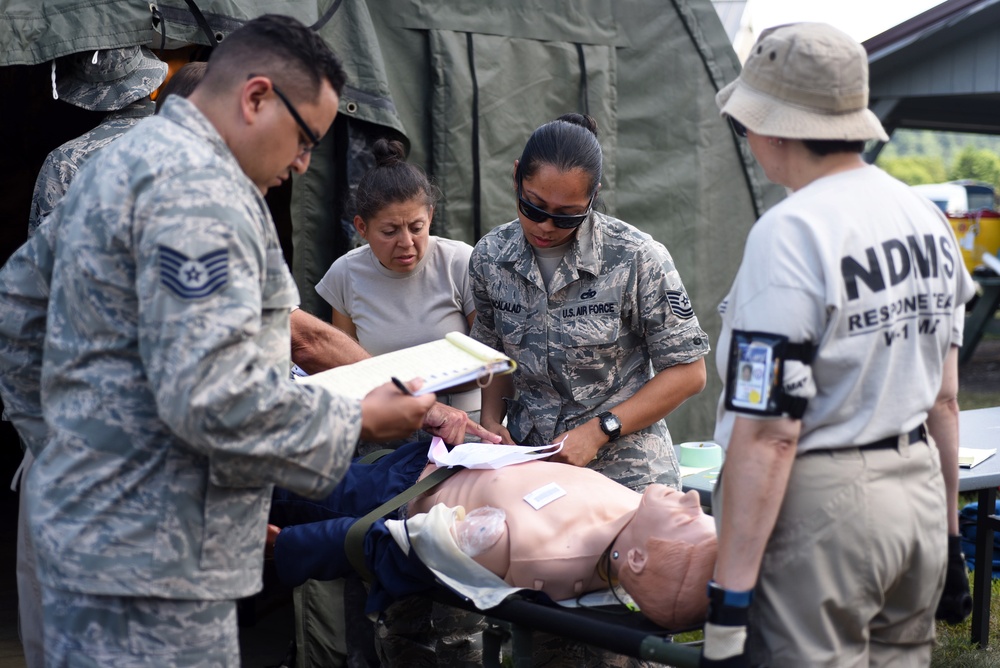 Airmen treat patients with Disaster Medical Assistance Team