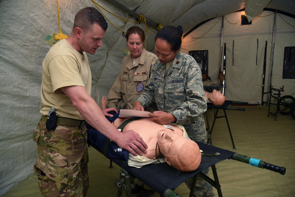 Airmen treat patients with Disaster Medical Assistance Team