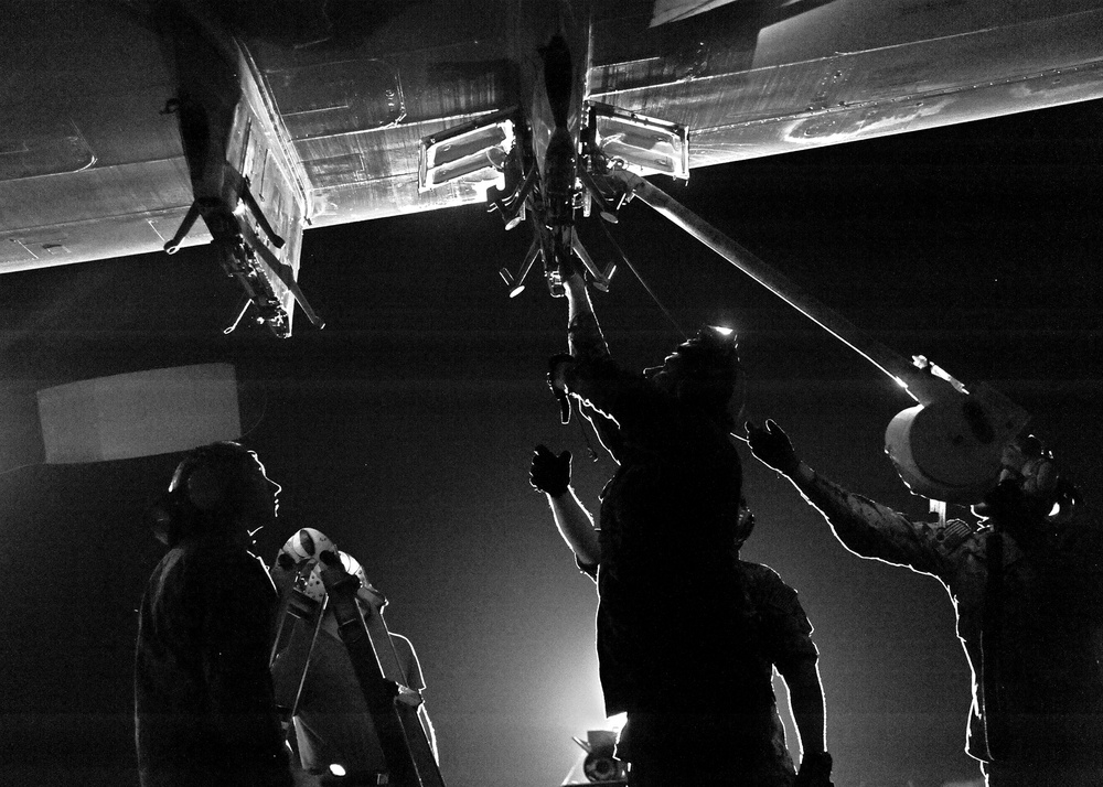 Patrol Squadron Sailors upload Maverick missiles during RIMPAC