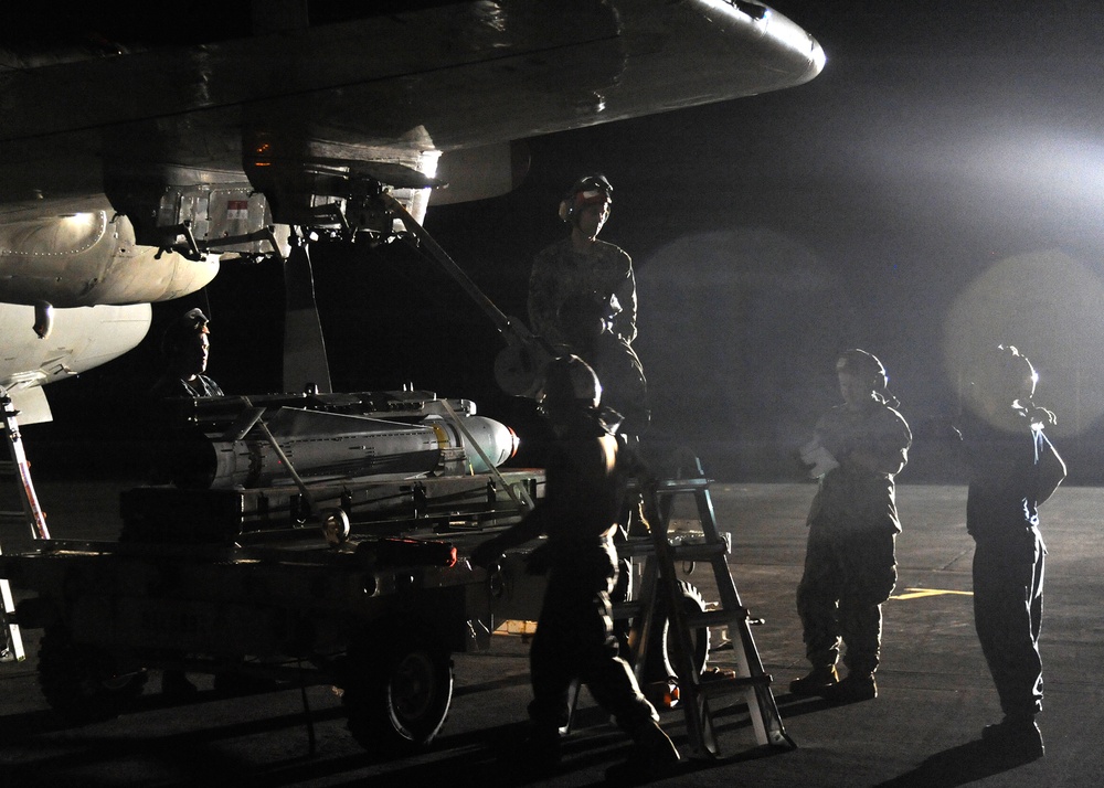 Patrol Squadron Sailors upload Maverick missiles during RIMPAC