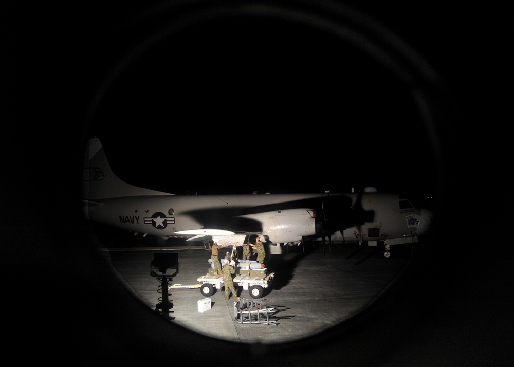 Patrol squadron Sailors upload Maverick missiles on P-3s during RIMPAC