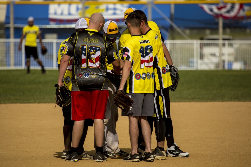 Service members compete in Firecracker Softball Tournament