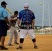 Service members compete in Firecracker Softball Tournament