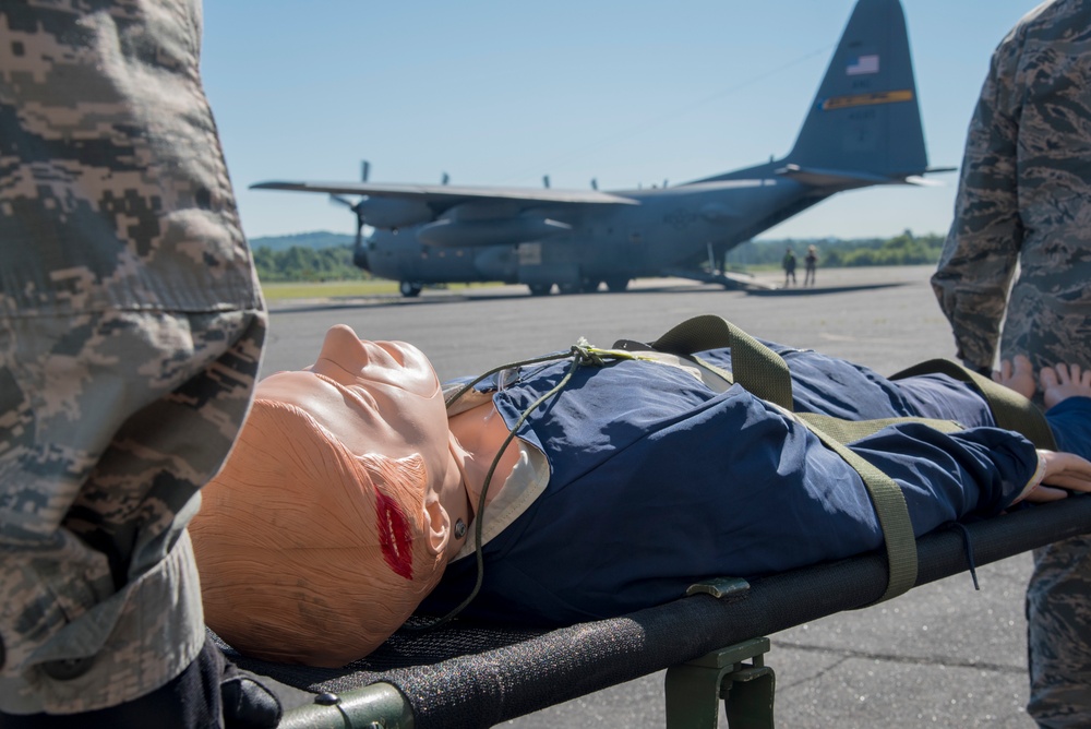 A patient gets carried on a C-130 Hercules for medical transport