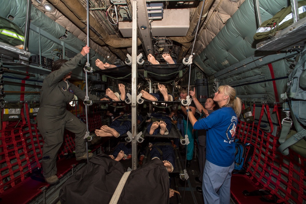 A flight nurse educates civilian nurses