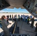A flight nurse gives instructions on off-loading patients from a C-130 Hercules