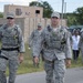Airmen walk to a simulated supply distribution location