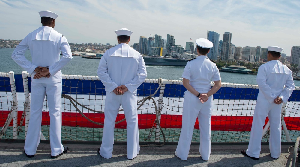 USNS Mercy Sailors man the rails as the ship returns to homeport after completion of Pacific Partnership 2018, participation in RIMPAC 2018