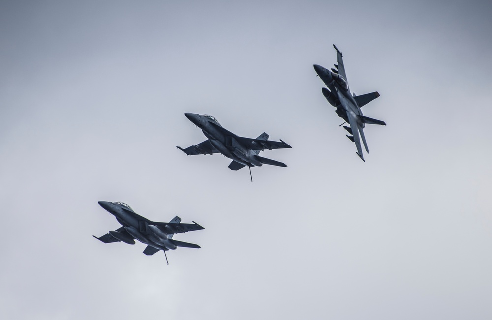 Super Hornets Fly in Formation near Vinson