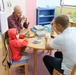 Soldiers spend the day playing with children at Kuwait hospitals