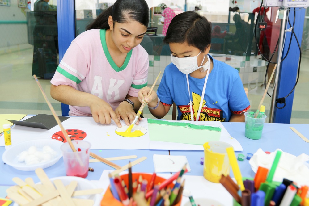 Soldiers spend the day playing with children at Kuwait hospitals