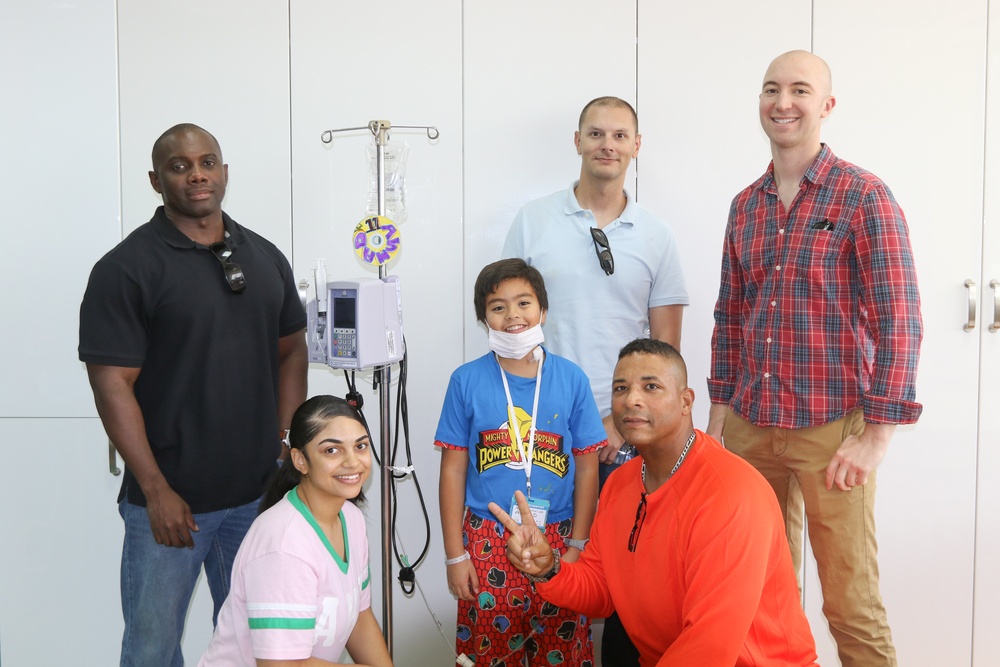 Soldiers spend the day playing with children at Kuwait hospitals