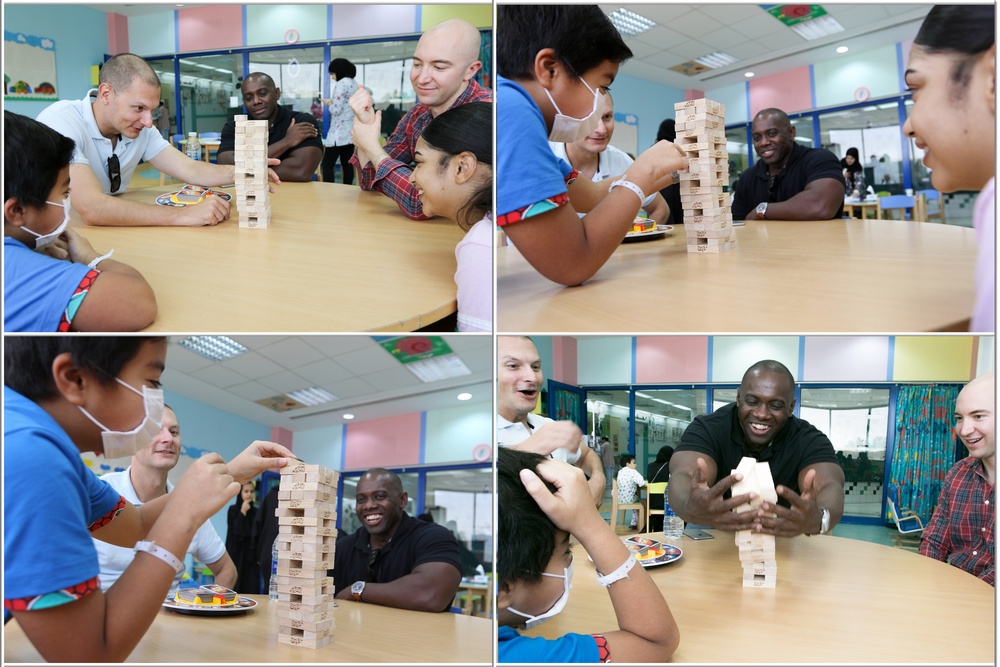 Soldiers spend the day playing with children at Kuwait hospitals
