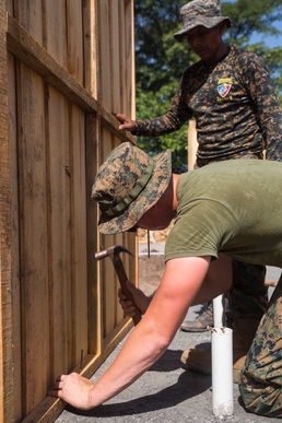 Hammers and shovels: Marines pitch in with Guatemalans to help those displaced by volcano