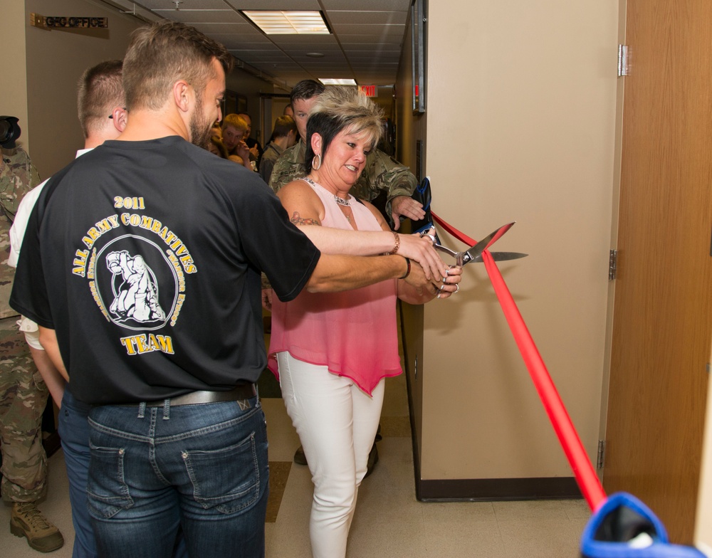 Family of late CSM cuts ribbon during dedication ceremony