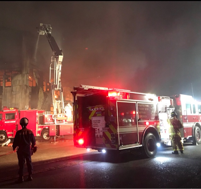 U.S. Navy Fire and Emergency Services Personnel Respond to Warehouse Fire