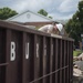 Staff Sgt. Daniel Arnold cleans up waste at the West Virginia Schools for the Deaf and the Blind