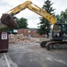 Staff Sgt. Daniel Arnold cleans up waste at the West Virginia Schools for the Deaf and the Blind