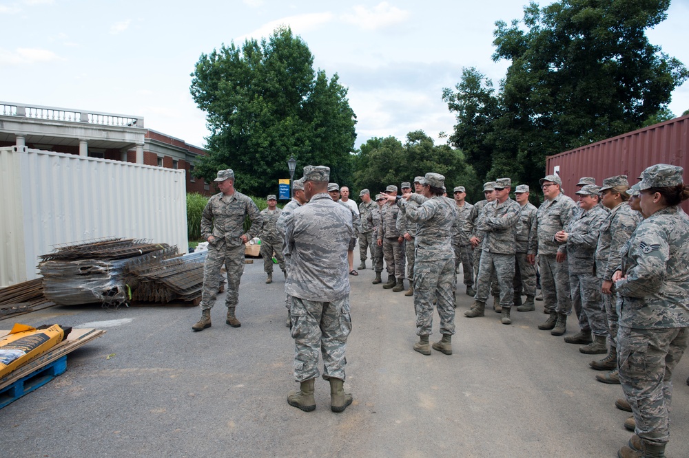 1st Lt. Amber S. Kenneda briefs Airmen at the West Virginia Schools for the Deaf and the Blind