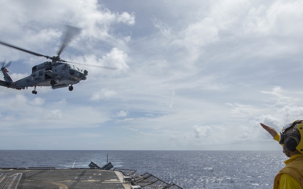 Commander, Carrier Strike Group One, Rear Adm. Alvin Holsey, departs USS Lake Champlain (CG 57)