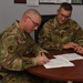 Deployed brothers reunite for reenlistment