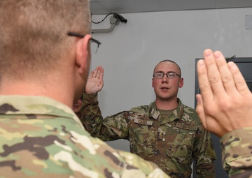 Deployed brothers reunite for reenlistment