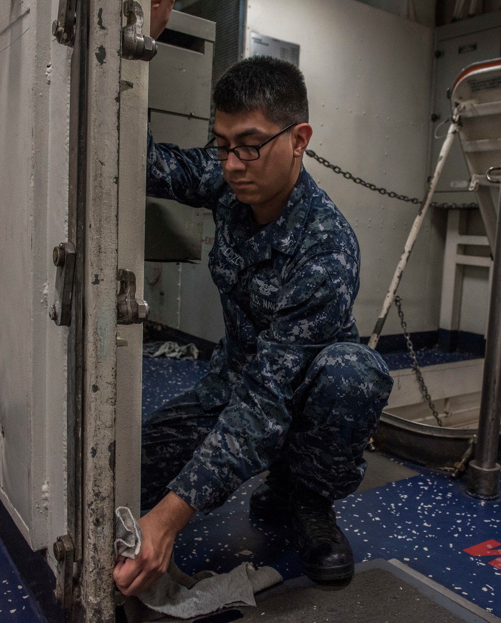 Sailor Aboard GHWB Cleans the Ship