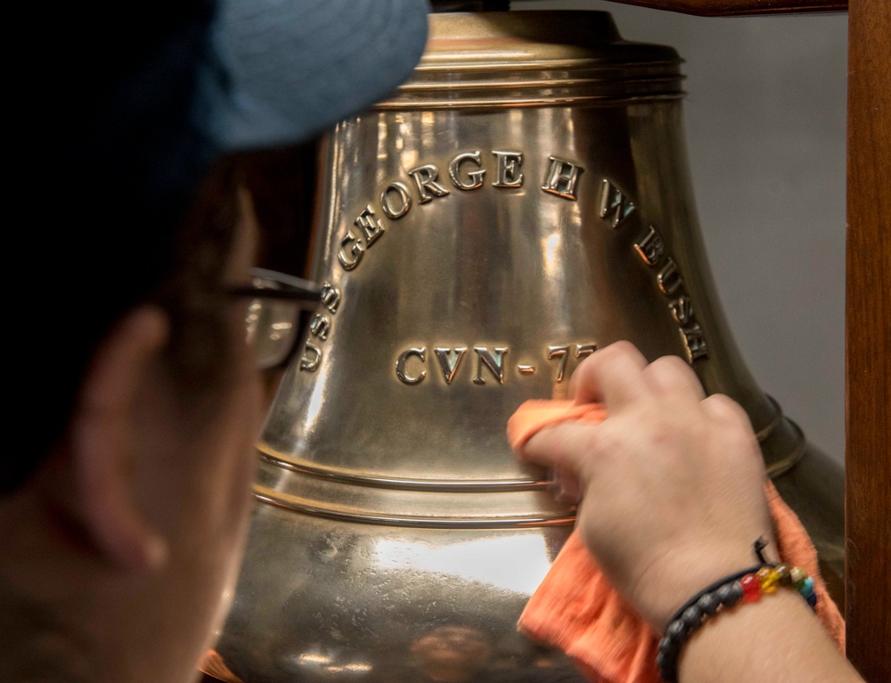 Sailor Shines the Ship's Bell Aboard GHWB