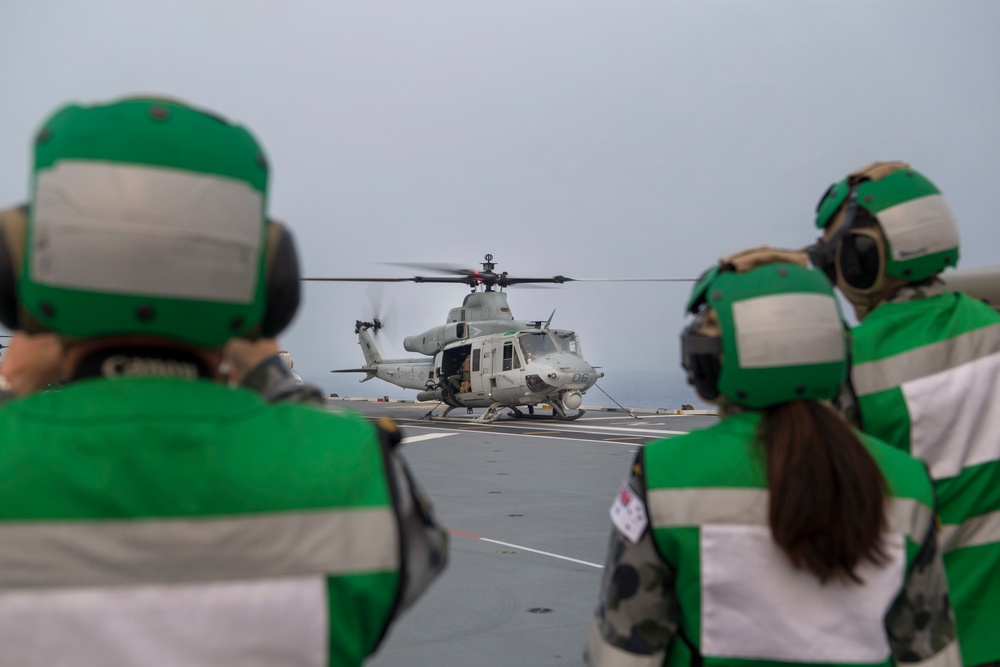 HMAS Adelaide conducts flight operations with U.S. Marine Corps UH-1Y Huey during RIMPAC