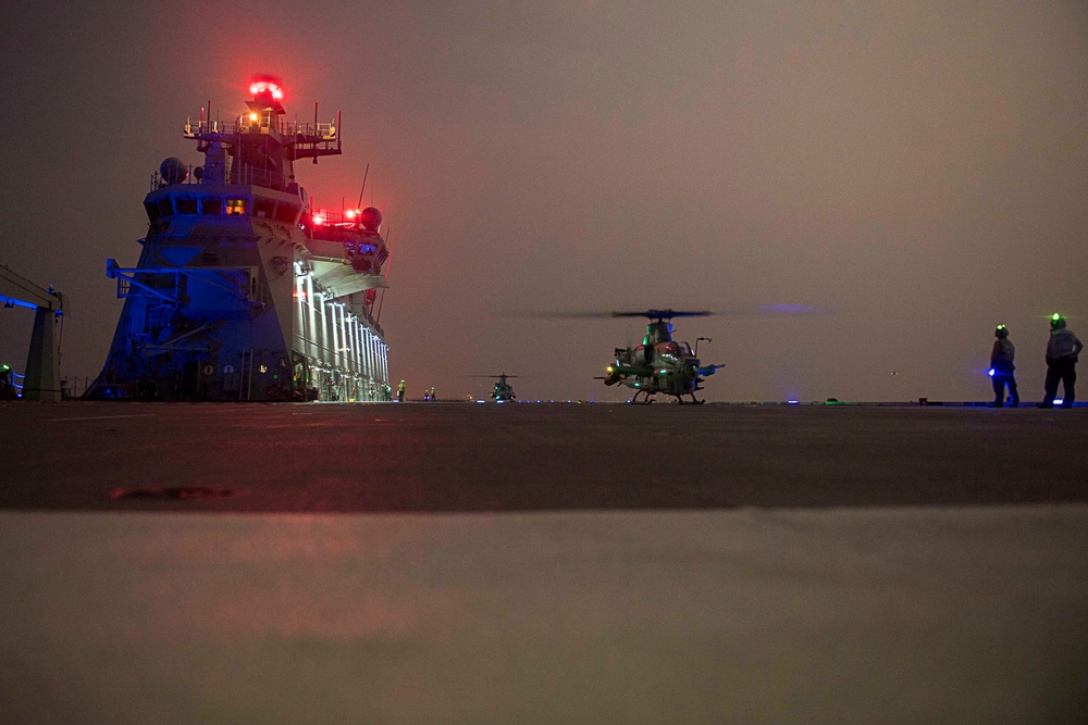 HMAS Adelaide conducts night operations with U.S. Marine Corps AH-1Z Cobras, UH-1Y Hueys during RIMPAC