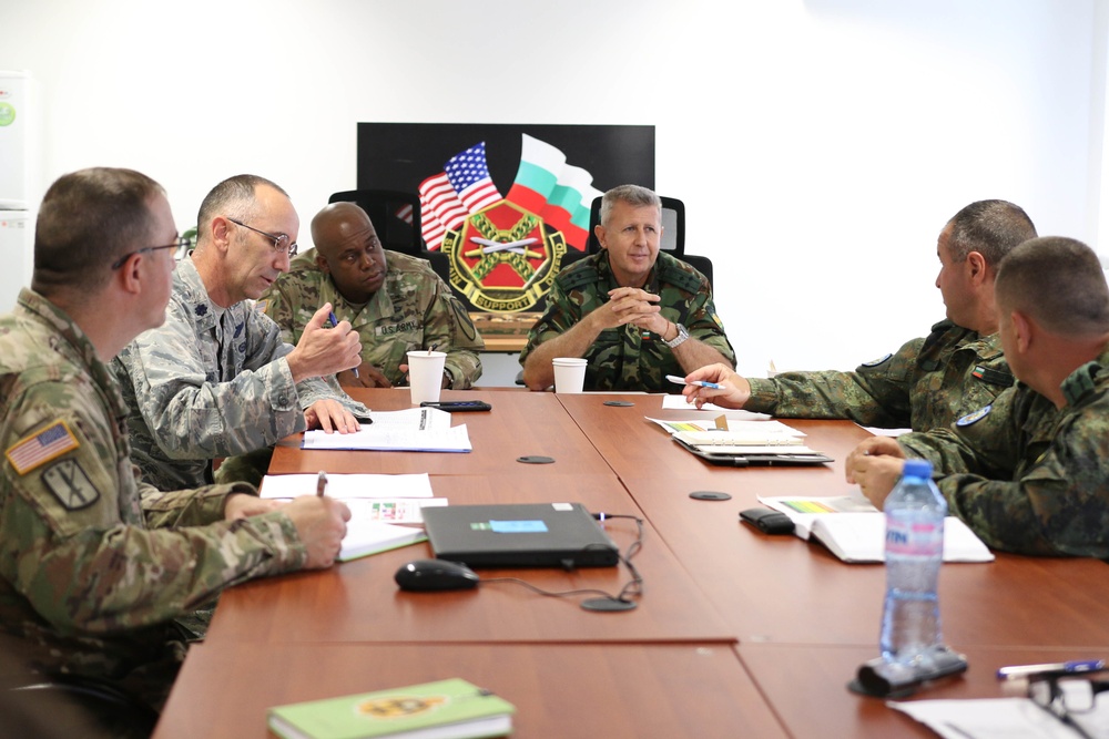 Members of the U.S. and Bulgarian Armed Forces discuss and plan future combined training exercises during a bilateral training conference