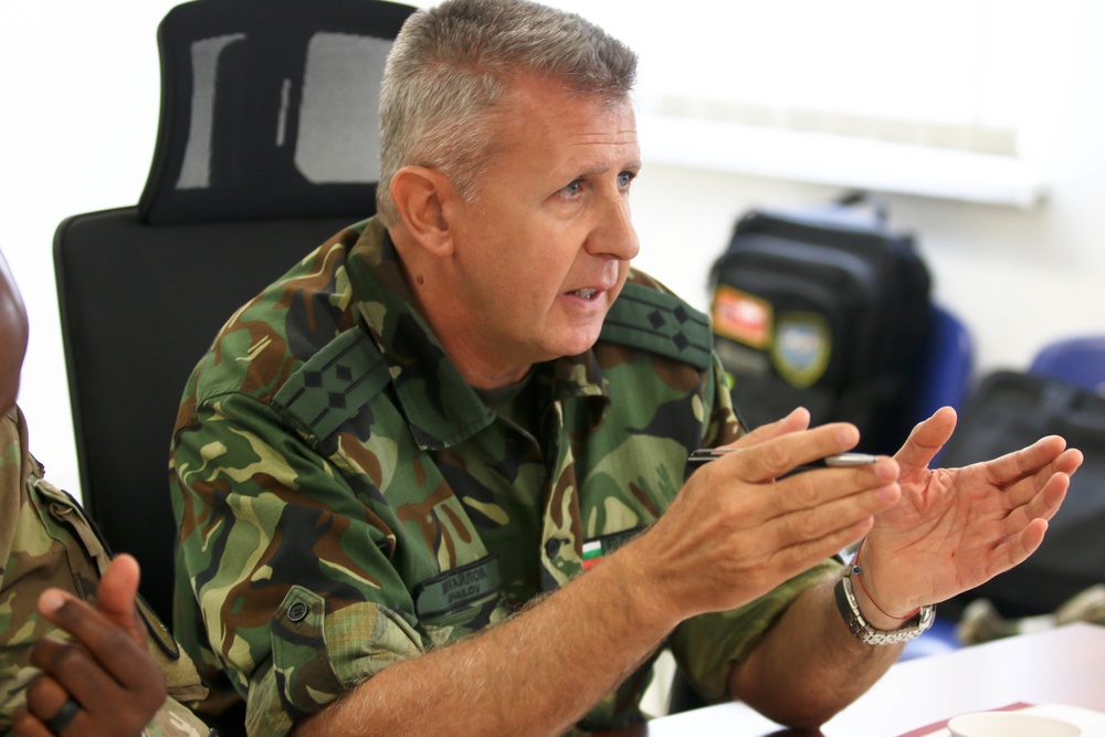 Members of the U.S. and Bulgarian Armed Forces discuss and plan future combined training exercises during a bilateral training conference