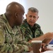 Members of the U.S. and Bulgarian Armed Forces discuss and plan future combined training exercises during a bilateral training conference