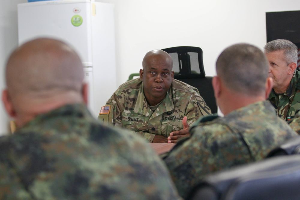 Members of the U.S. and Bulgarian Armed Forces discuss and plan future combined training exercises during a bilateral training conference.