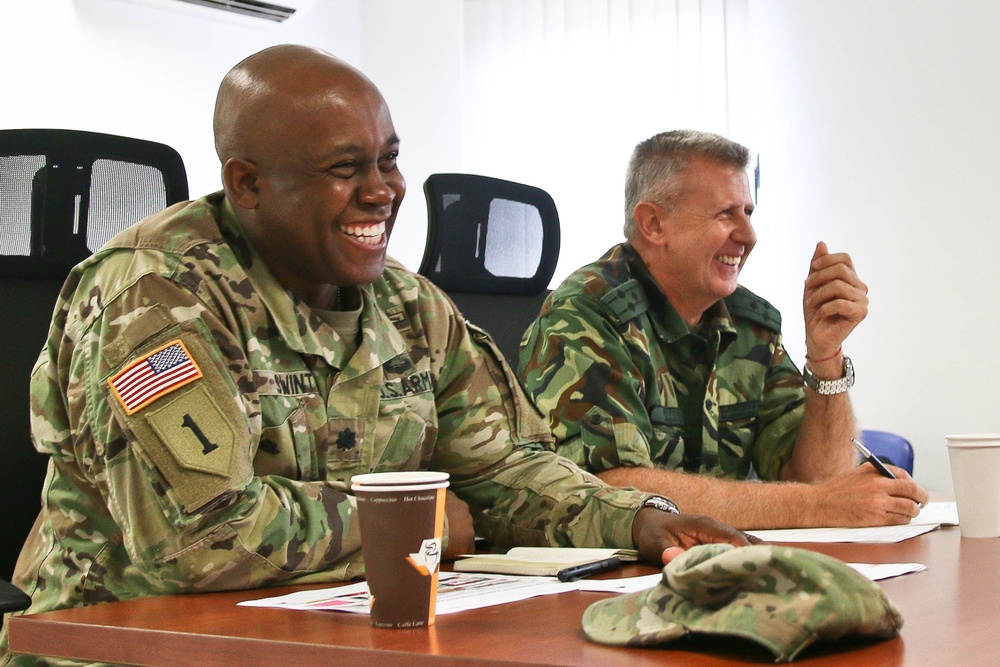 Members of the U.S. and Bulgarian Armed Forces discuss and plan future combined training exercises during a bilateral training conference.