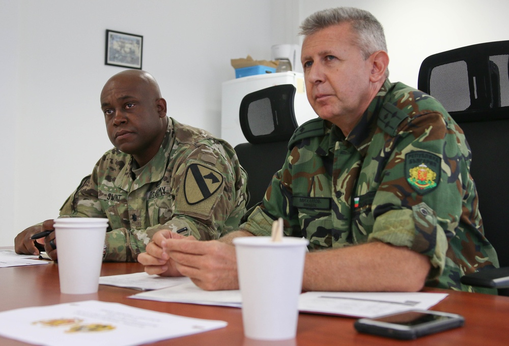 Members of the U.S. and Bulgarian Armed Forces discuss and plan future combined training exercises during a bilateral training conference.