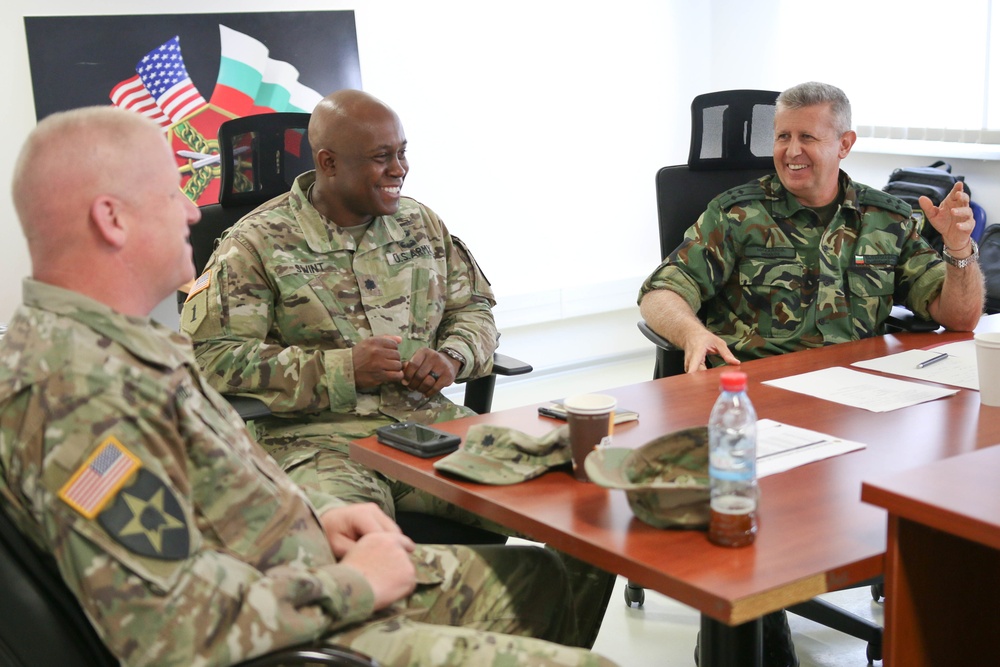 Members of the U.S. and Bulgarian Armed Forces discuss and plan future combined training exercises during a bilateral training conference.