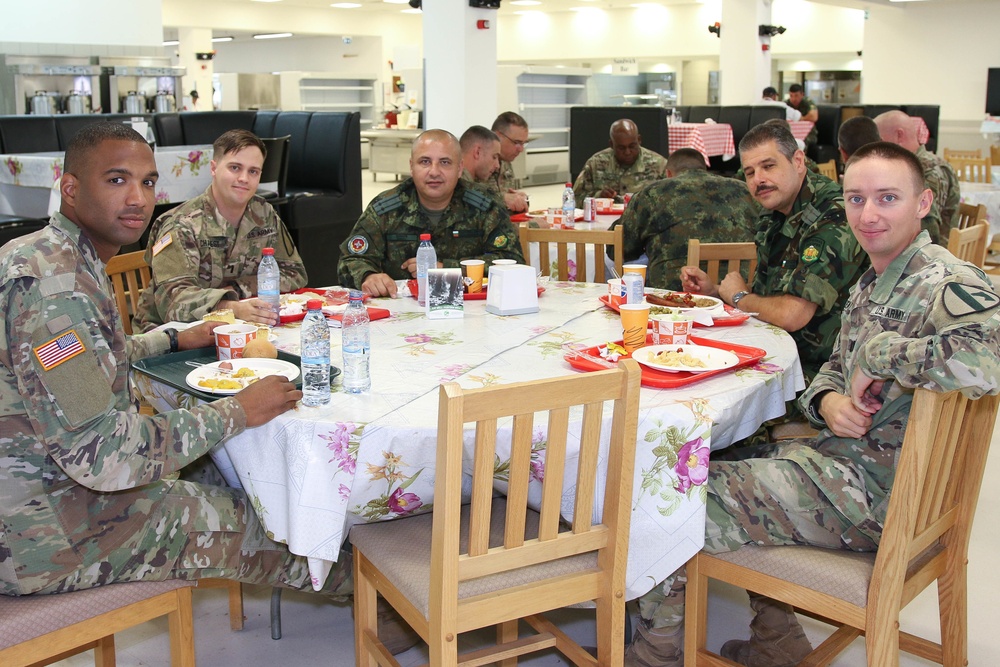 Members of the U.S. and Bulgarian Armed Forces discuss and plan future combined training exercises during a bilateral training conference.