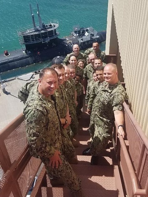 Capt. Jeff Butcher poses with Navy Reserve Sailors