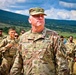 Army Col. Wilson Rutherford speaks to his troops in the field